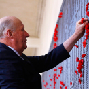 The names of Australia’s fallen soldiers are inscribed in bronze in the Roll of Honour. King Harald placed a paper poppy by one of the names today. Photo: David Gray, Reuters / NTB scanpix 